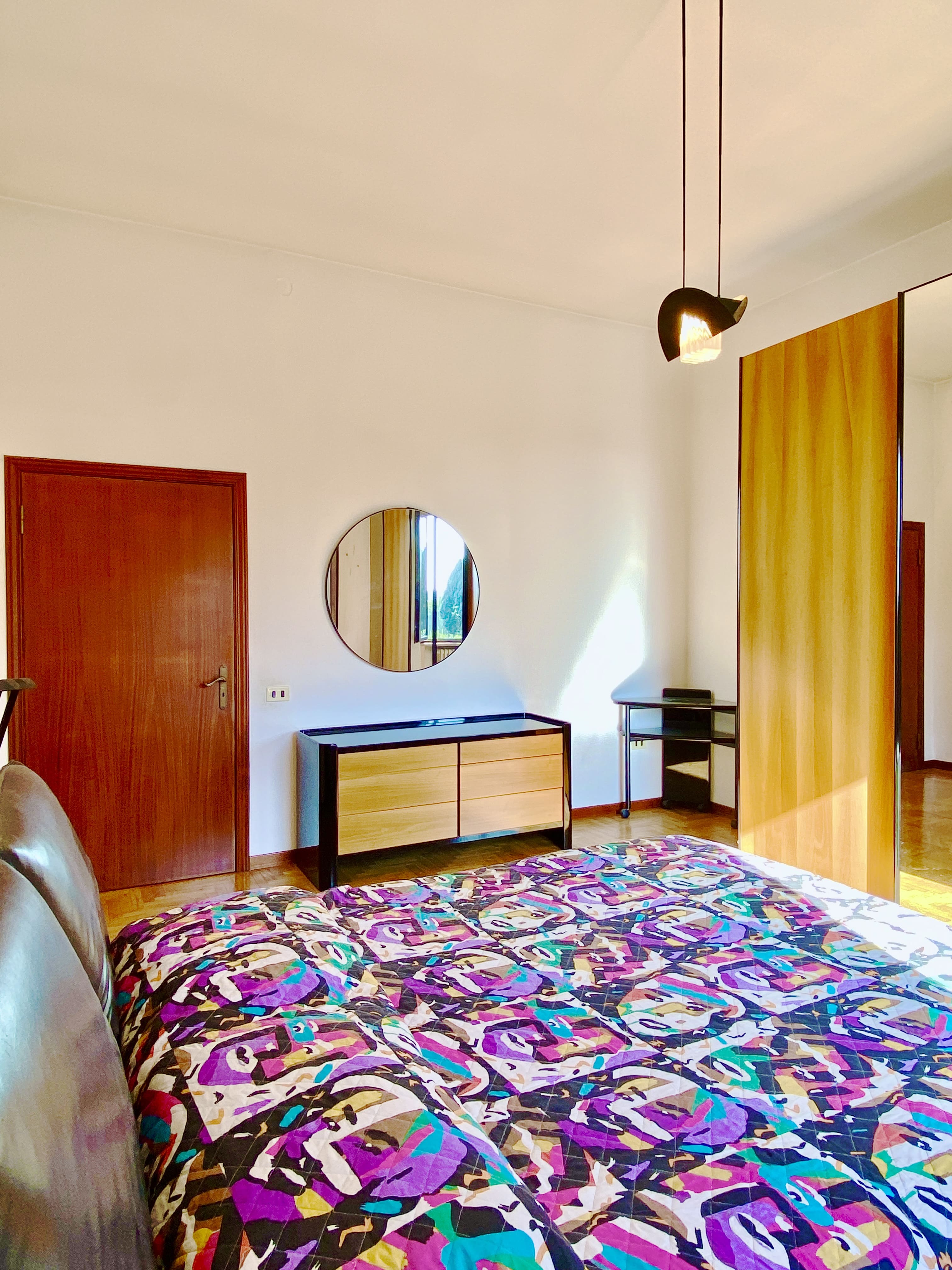 Spacious double bedroom with parquet floor